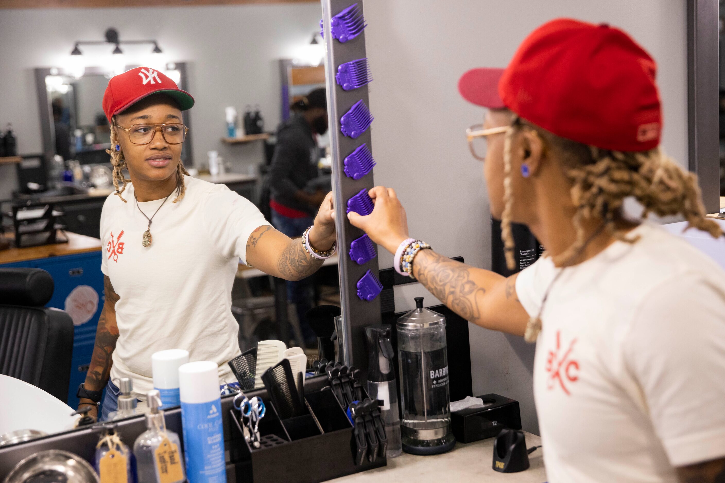 Markasia Davis prepares before class at the Blade Craft Barber Academy in the Deep Ellum...