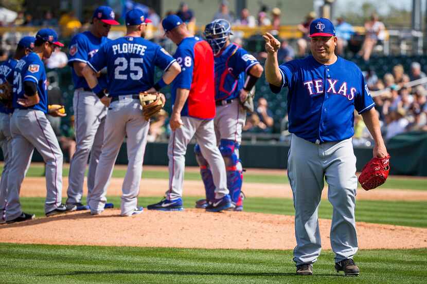 Texas Rangers pitcher Bartolo Colon acknowledges the crowd as he leaves the game during the...