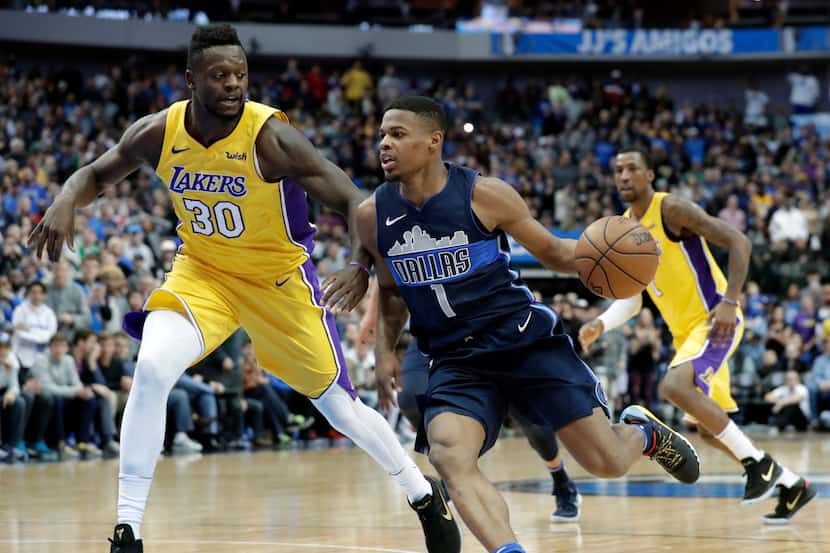 Los Angeles Lakers forward Julius Randle (30) defends as Dallas Mavericks guard Dennis Smith...