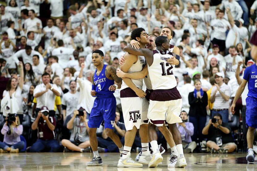 Texas A&M's Tyler Davis (left) celebrates his game winning shot with teammates during...