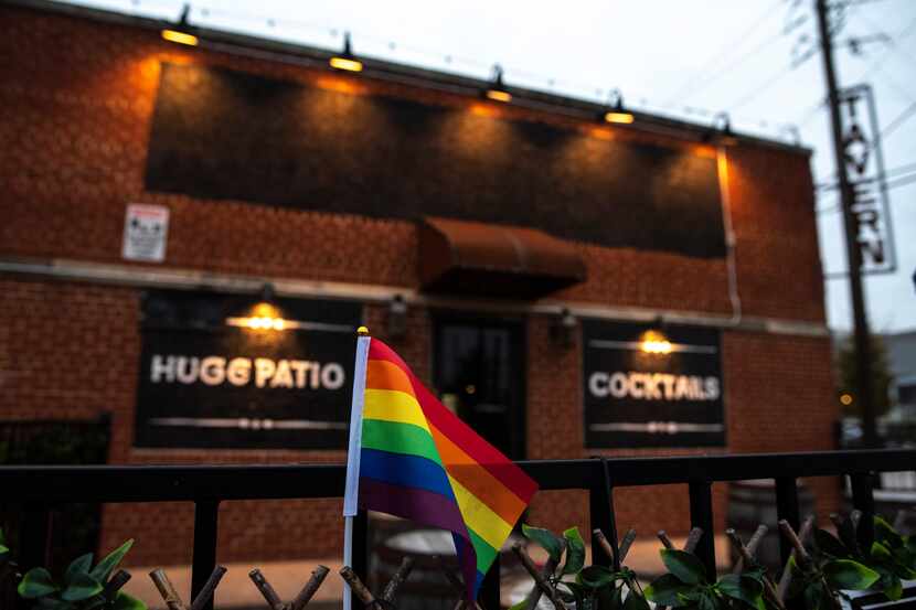 A small Pride flag is on display outside of Redfield's Tavern in Dallas, on Oct. 24, 2020....