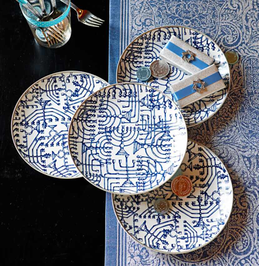 Blue and white porcelain plates recall ancient temple menorahs. $49.95/4. The complementary...