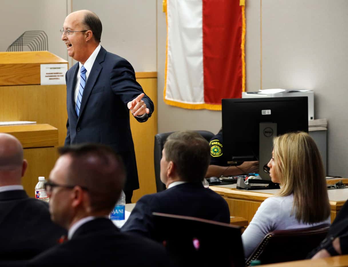 Defense attorney Robert Rogers (left) points to his client, Amber Guyger, during closing...