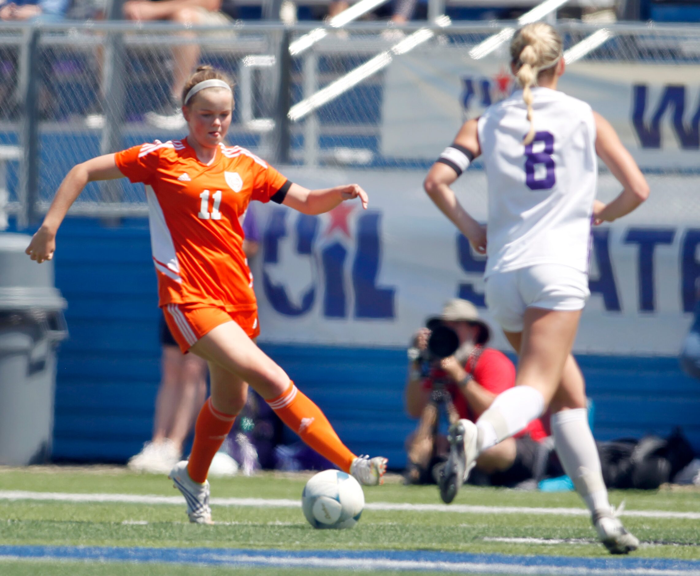 Celina's Madi Vana (11) controls the ball around the defense of Boerne's Lylie Combs (8)...