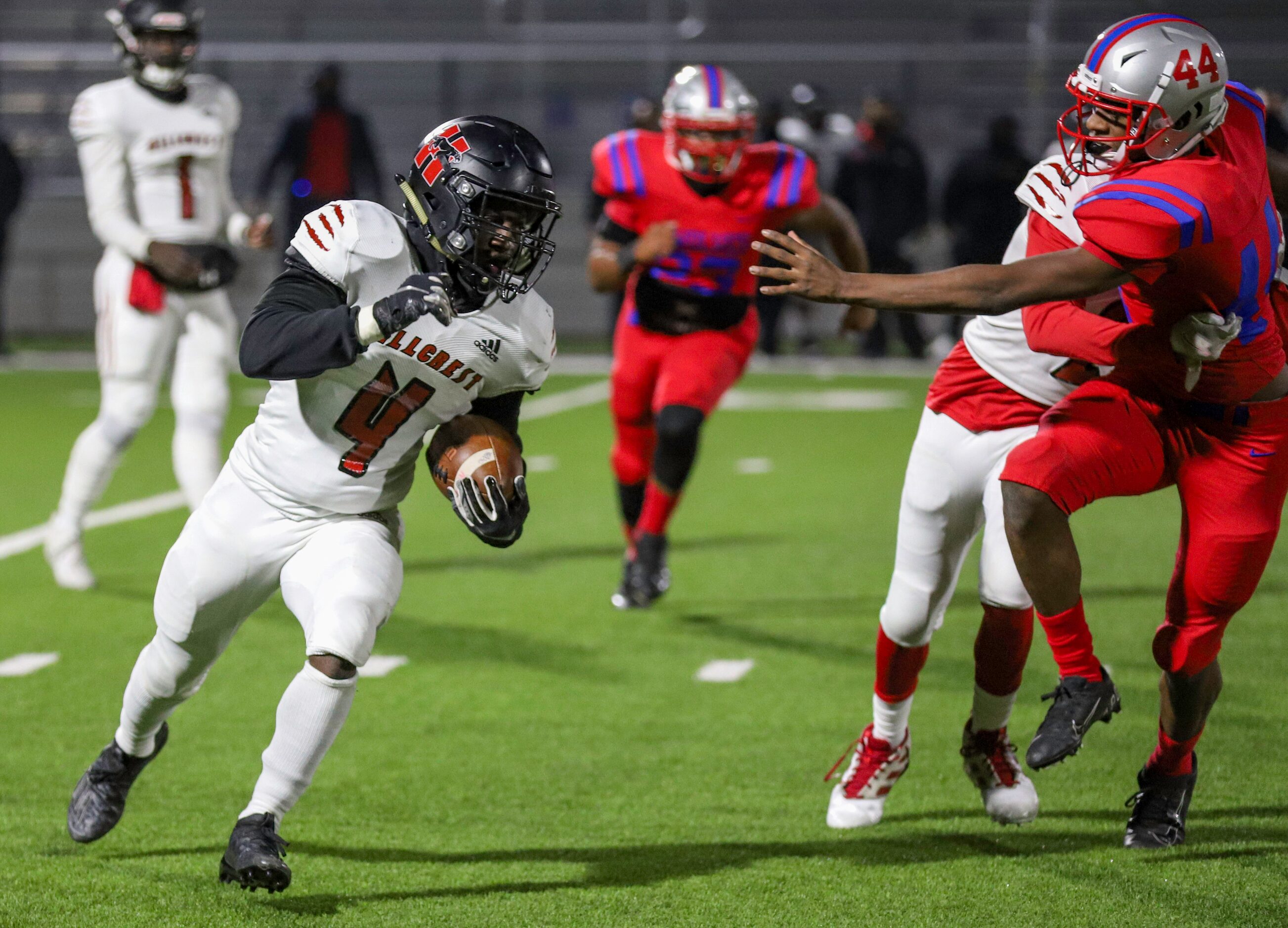 Hillcrest running back Nasir Reynolds (4) runs around Spruce defensive back Sherrod Smith...