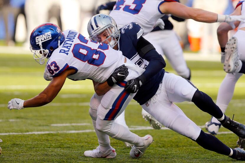 Dallas Cowboys strong safety Jeff Heath (38) makes a tackle on New York Giants kick returner...