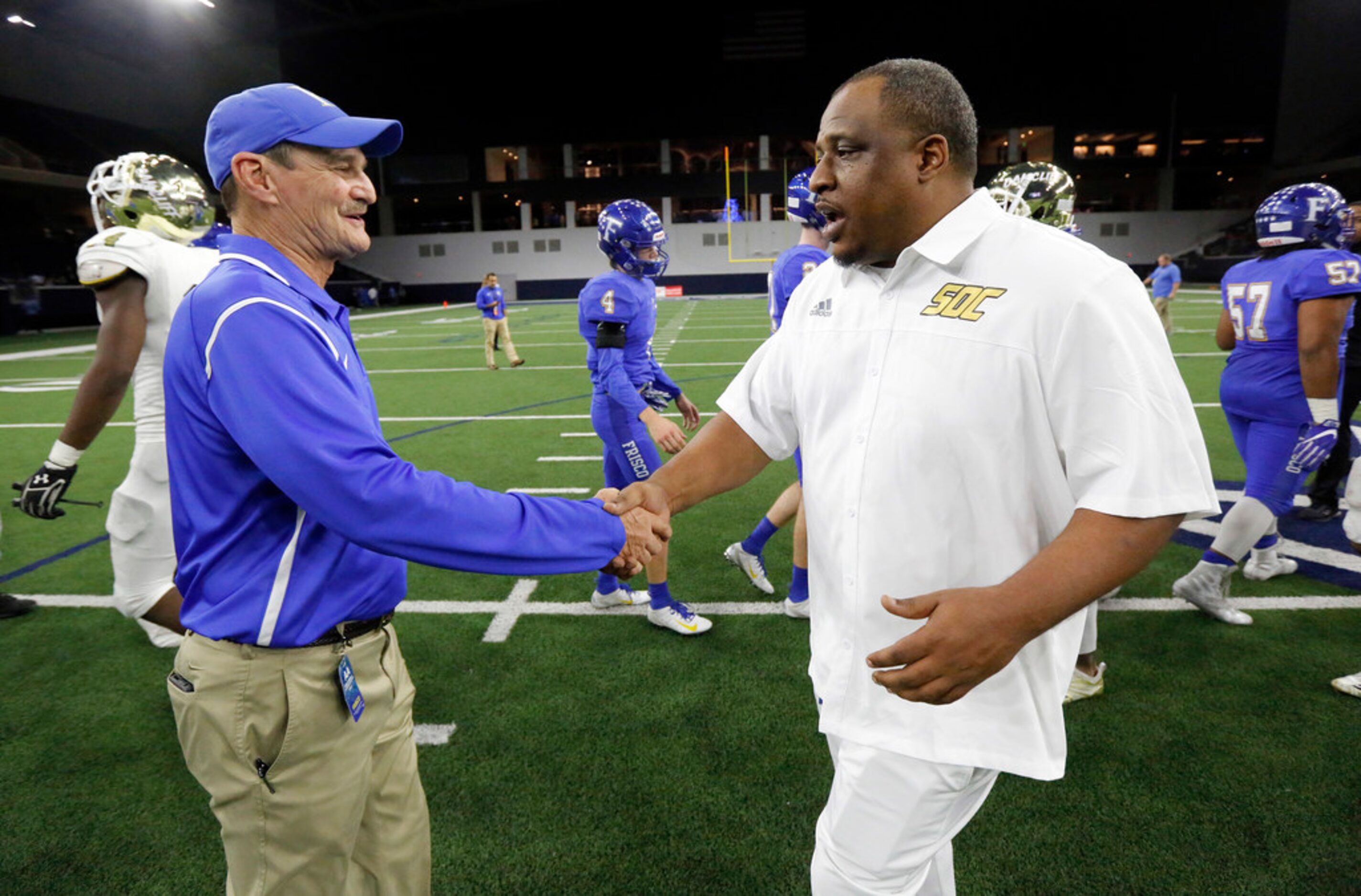 Frisco head coach Vance Gibson (left) congratulates South Oak Cliff head coach Jason Todd on...