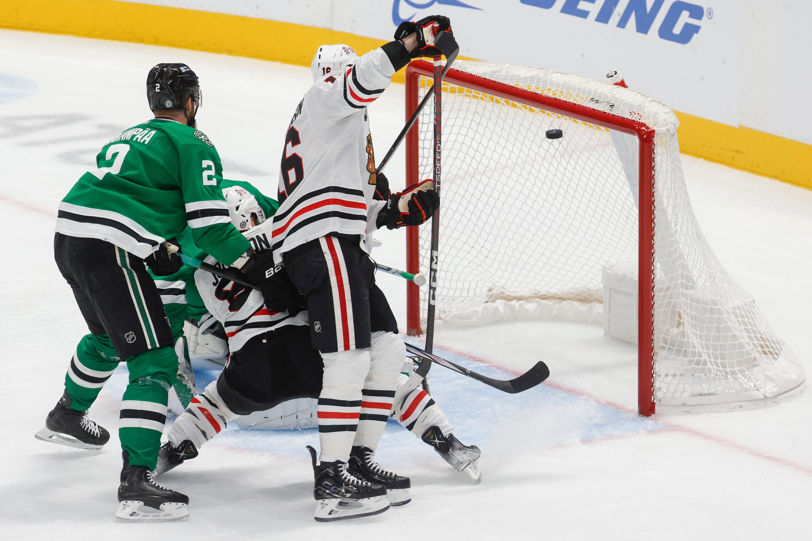 Chicago Blackhawks center Tyler Johnson (center) score a goal against the Dallas Stars...