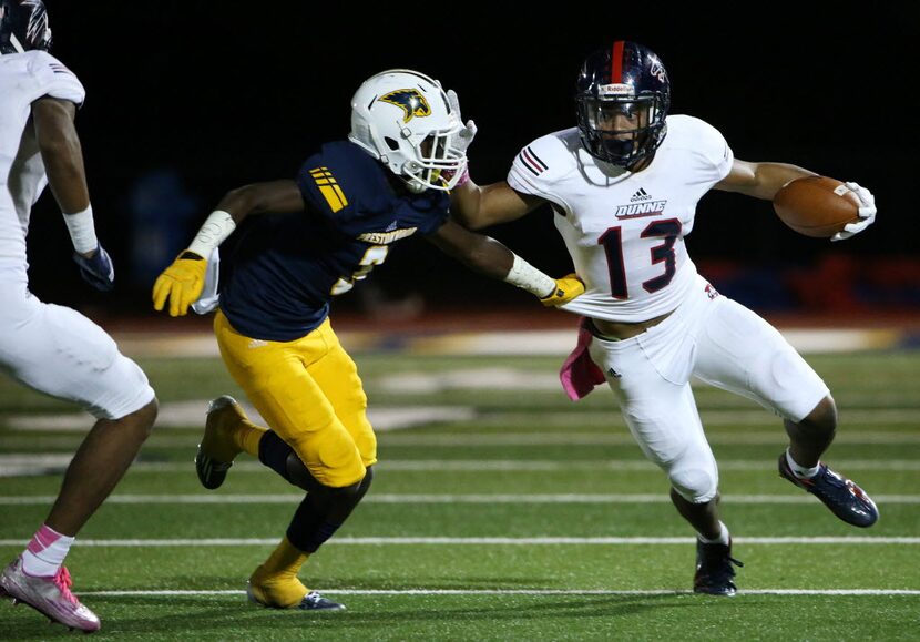 Bishop Dunne wide receiver Geraud Sanders (13) avoids a tackle by Prestonwood Christian...