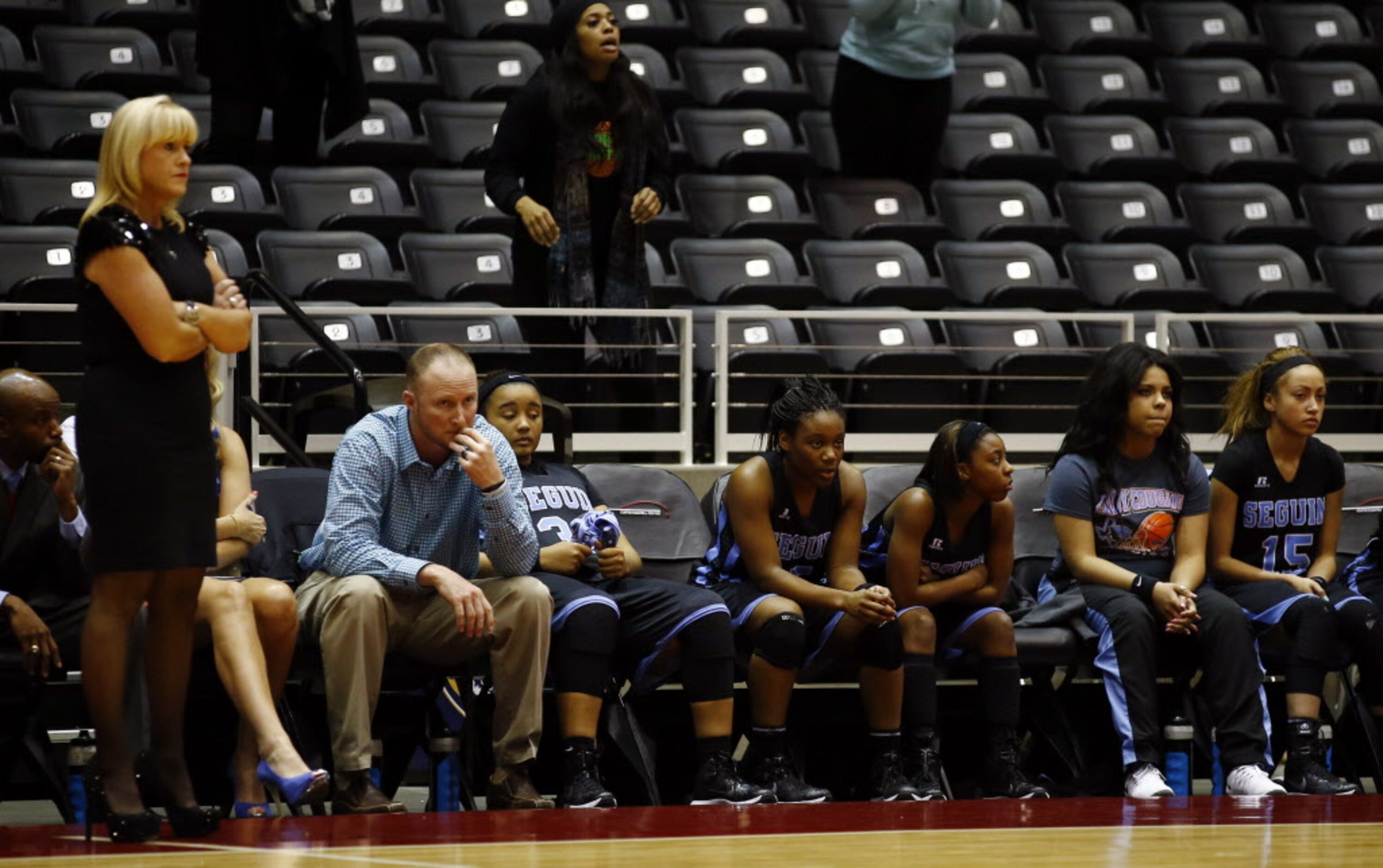 Arlington Seguin head coach  Courtney Phillips and the Sequin bench react in the final...