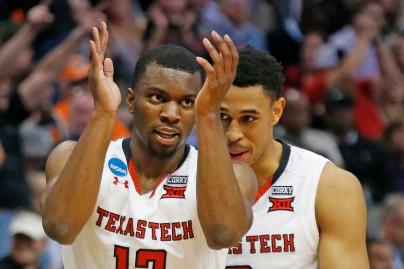 Texas Tech Red Raiders guard Keenan Evans (12) celebrates with teammate Zhaire Smith (2) as...
