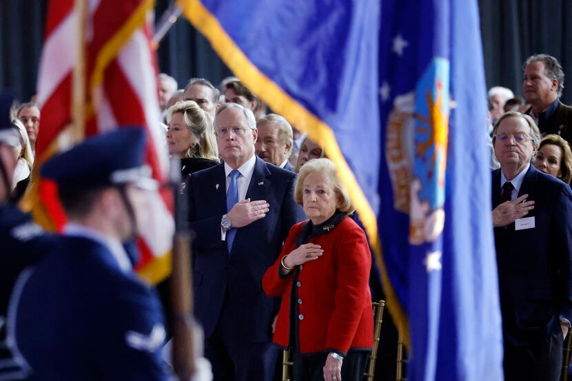 Ross Perot Jr. and his mother, Margot Birmingham Perot (center), stand as as the color guard...