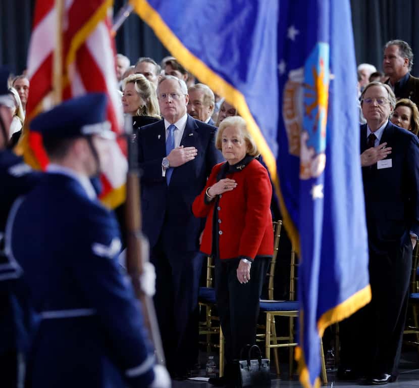 Ross Perot Jr. and his mother, Margot Perot (center), stood as a the color guard presented...