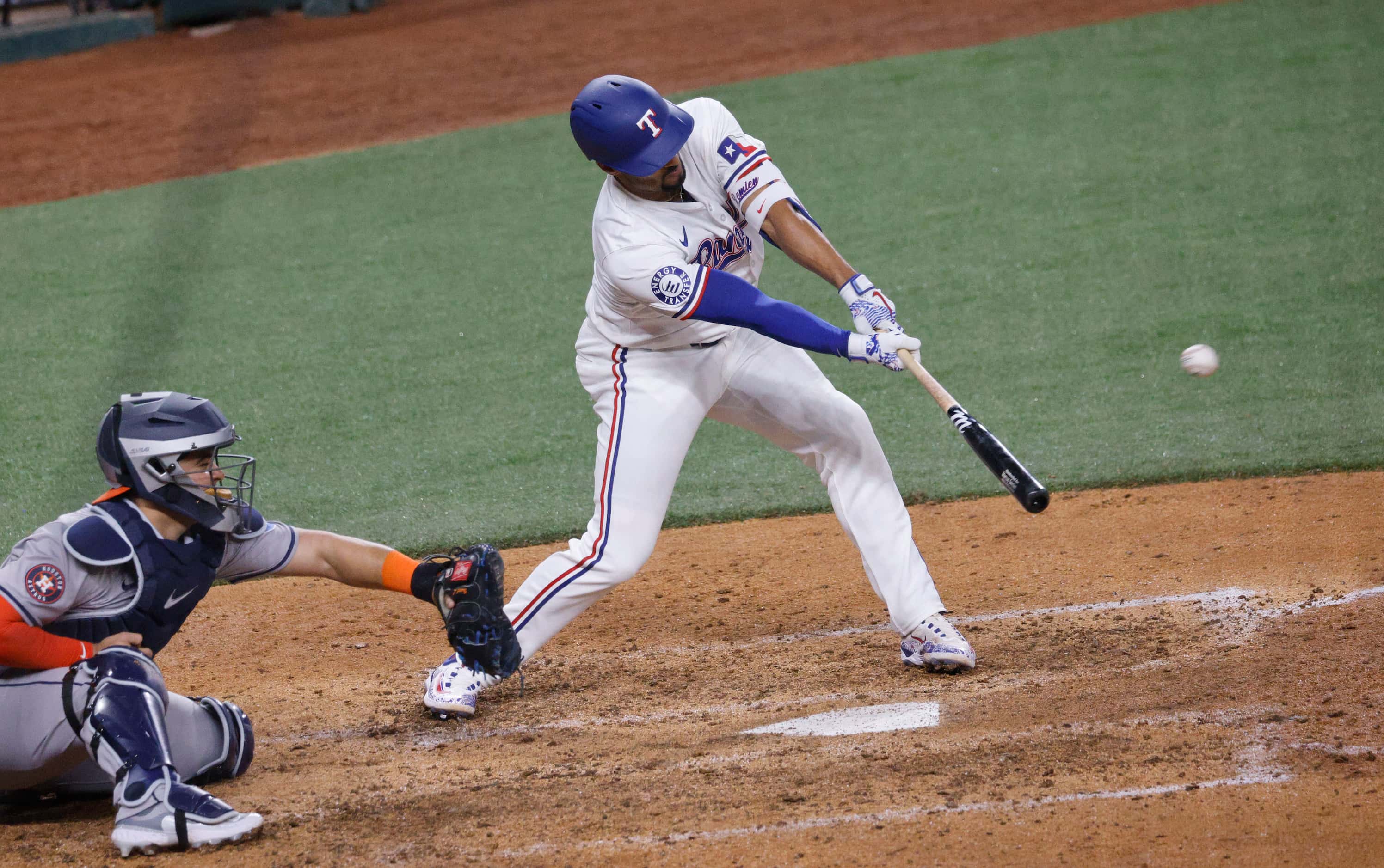 Texas Rangers second base Marcus Semien (2) hits an RBI single during the sixth inning of a...