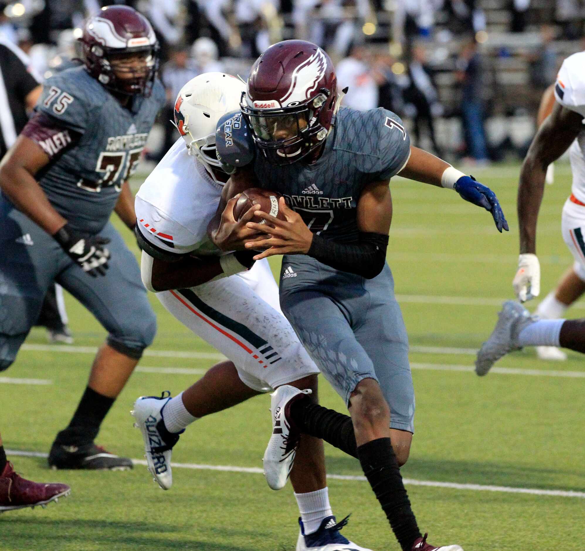 Rowlett QB James Okolo (7) is rundown by Sachse defender TK Burnley (92) during the first...
