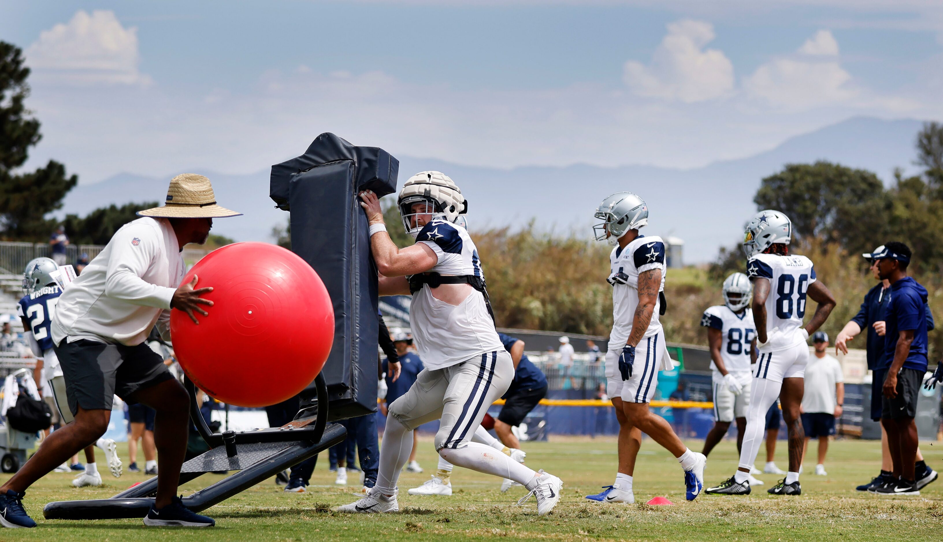 Dallas Cowboys tight end Dalton Schultz (86) pushes off the blocking sled before catching a...