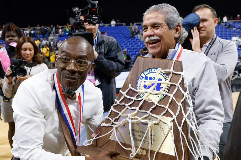 Madison boys basketball coach Damien Mobley (left) accepts the Class 3A state championship...