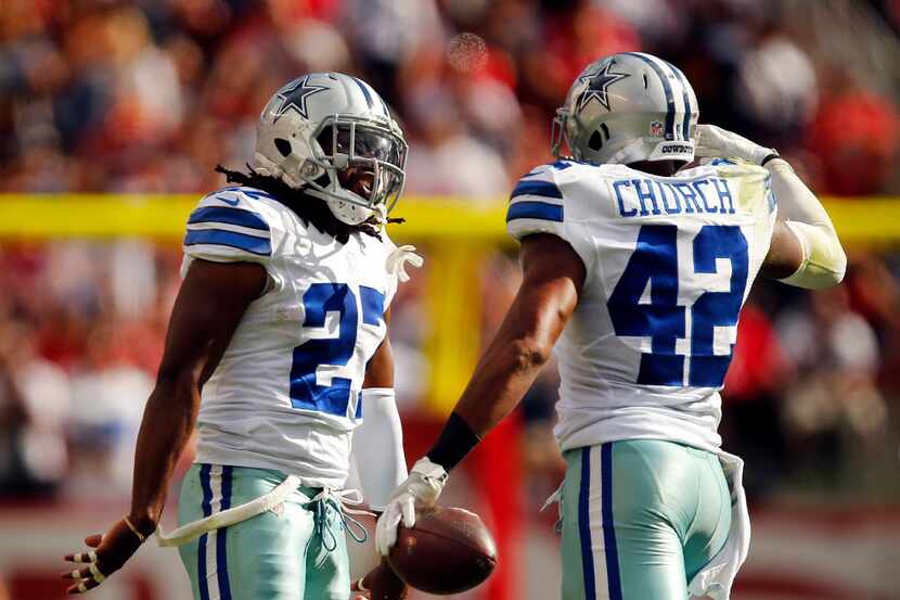 Former Cowboys safeties Barry Church (42) and J.J. Wilcox (27) celebrate a big play during...
