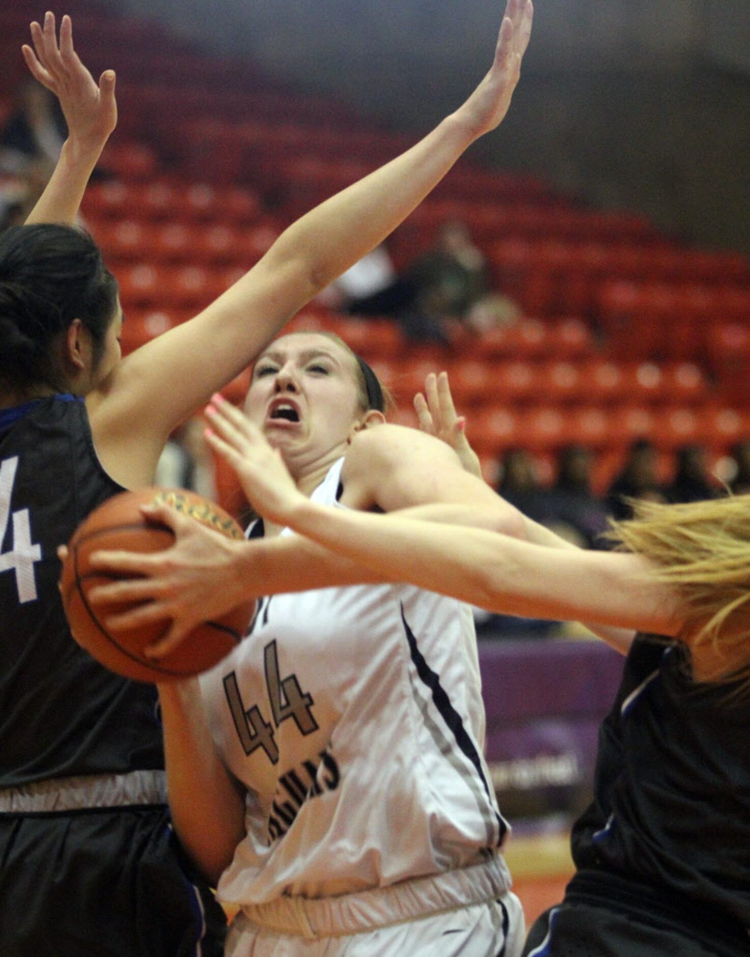 Flower Mound High School junior Lauren Cox (44) is fouled by Plano West junior Morgann...