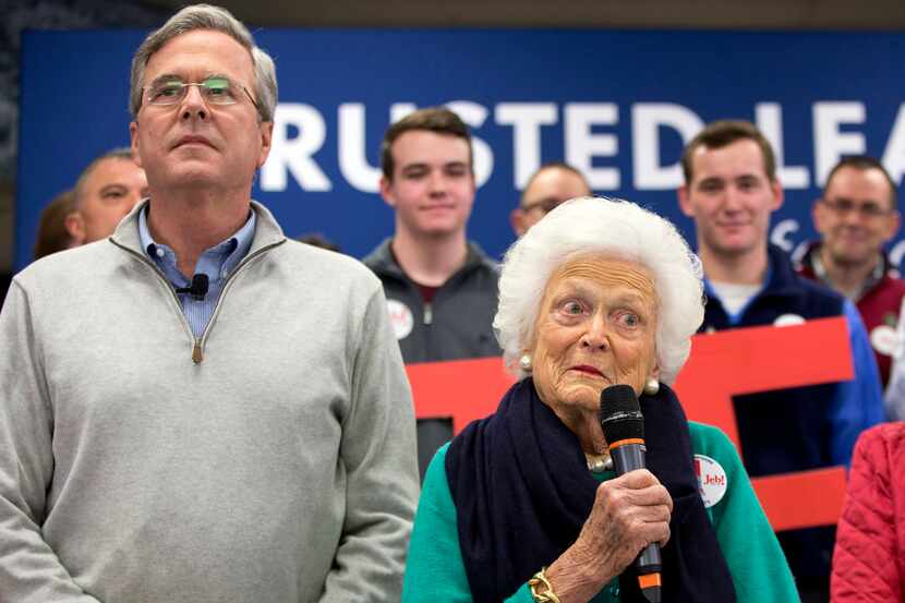  Former Florida Gov. Jeb Bush, left, and mother Barbara Bush, right, speak at a town hall...