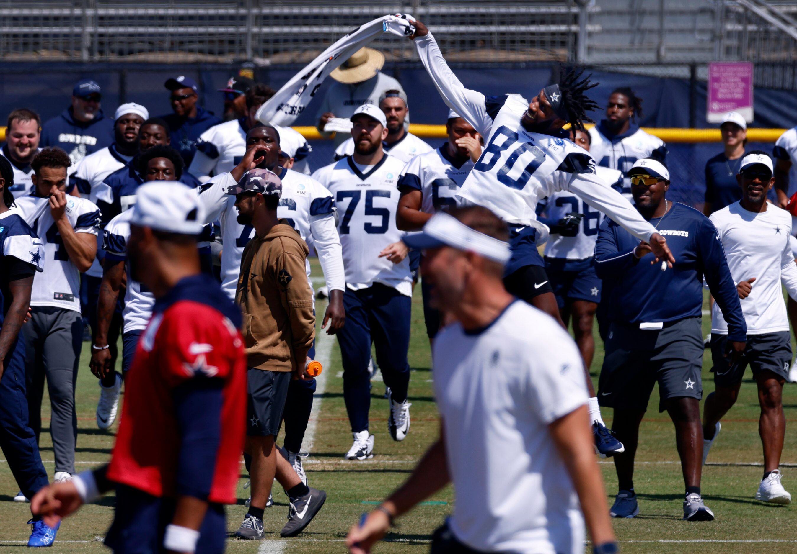 Dallas Cowboys wide receiver Racey McMath (80) throws his towel in the air as the third team...