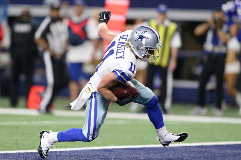 Dallas Cowboys wide receiver Cole Beasley (11) scores a touchdown in a game against the...
