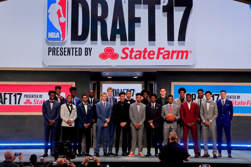 FILE - In this June 22, 2017, file photo, top draft prospects gather for a group photo...