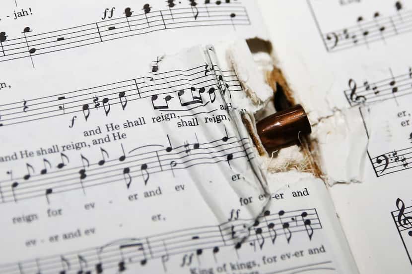 A bullet lodged in the spine of a hymnal was among items in a special display on the...