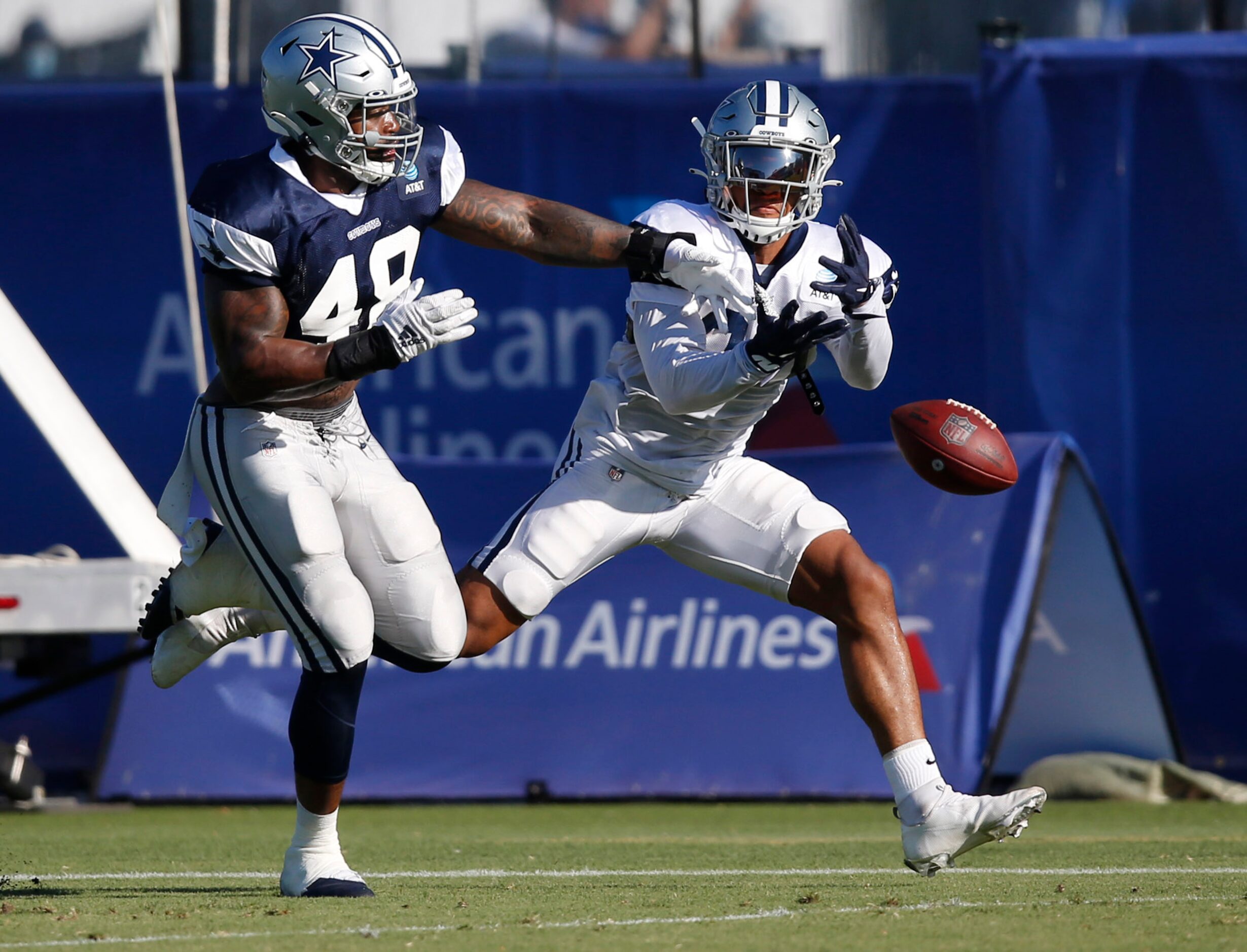 Dallas Cowboys running back Tony Pollard (20) misses the pass as Dallas Cowboys linebacker...