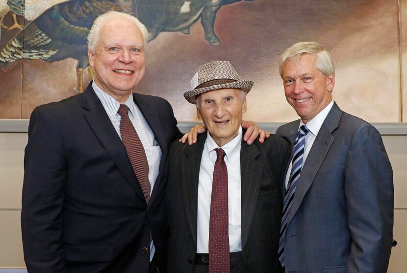 
Miller received congratulations at his retirement reception Monday from Bob Mong (left),...