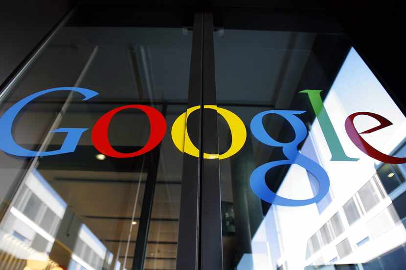 FILE - In this March 6, 2008 file photo, the Google logo is seen on the front door of the...