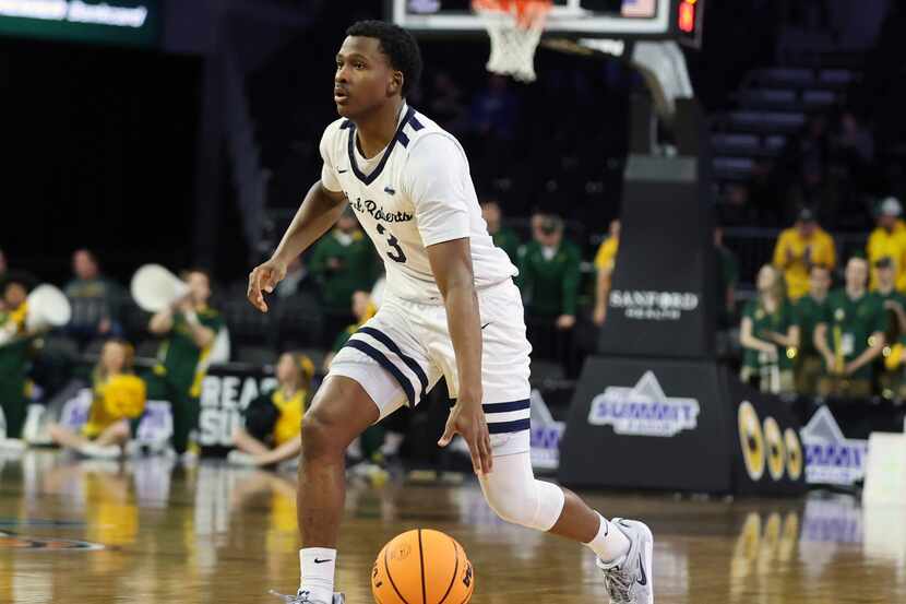 Oral Roberts G Max Abmas (3) dribbles the ball up the court against North Dakota State...