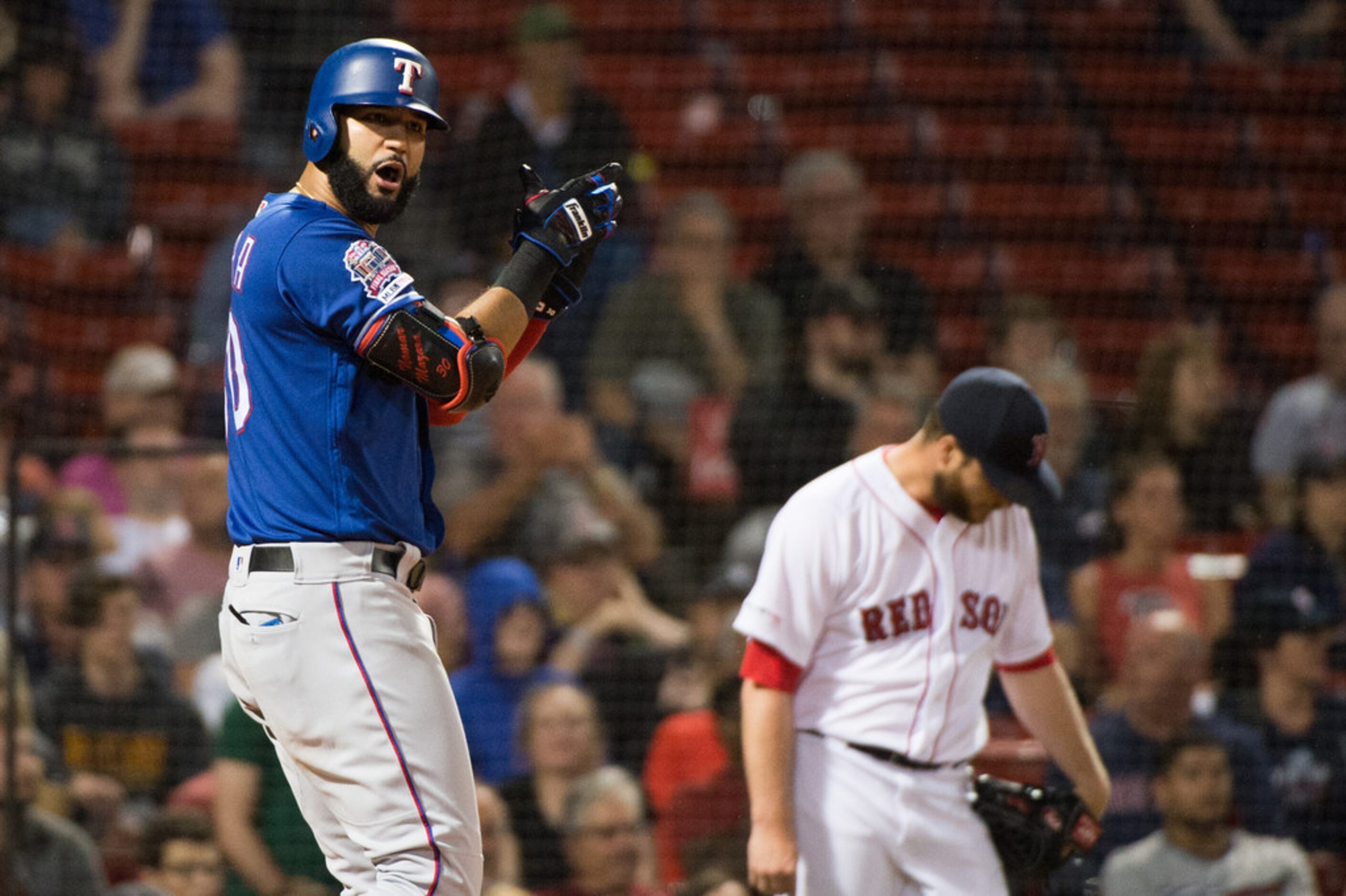 BOSTON, MA - JUNE 10: Nomar Mazara #30 celebrates as Danny Santana #38 (not pictured) of the...