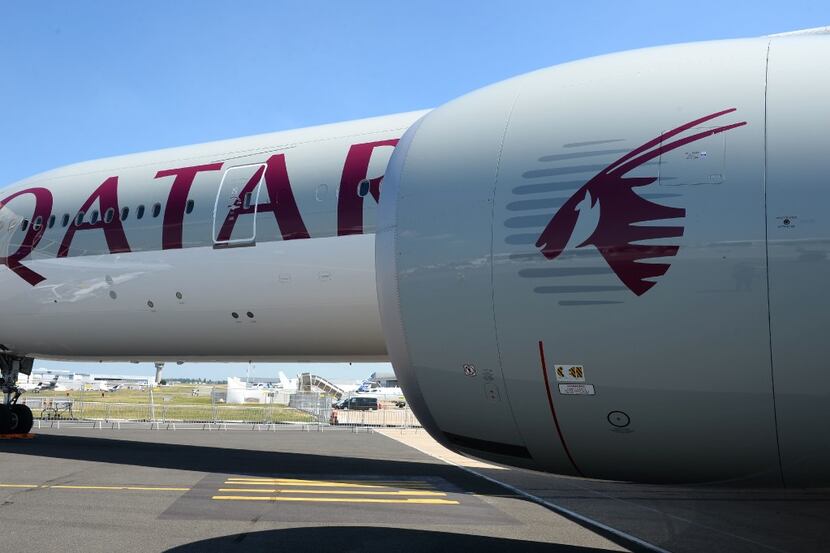 (FILES) This file photo taken on June 18, 2017 shows a Qatar Airways Boeing 777-300  on the...
