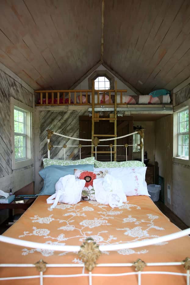 The second-story bedroom and loft in the Bare Creek Treehouse at Savannah's Meadow