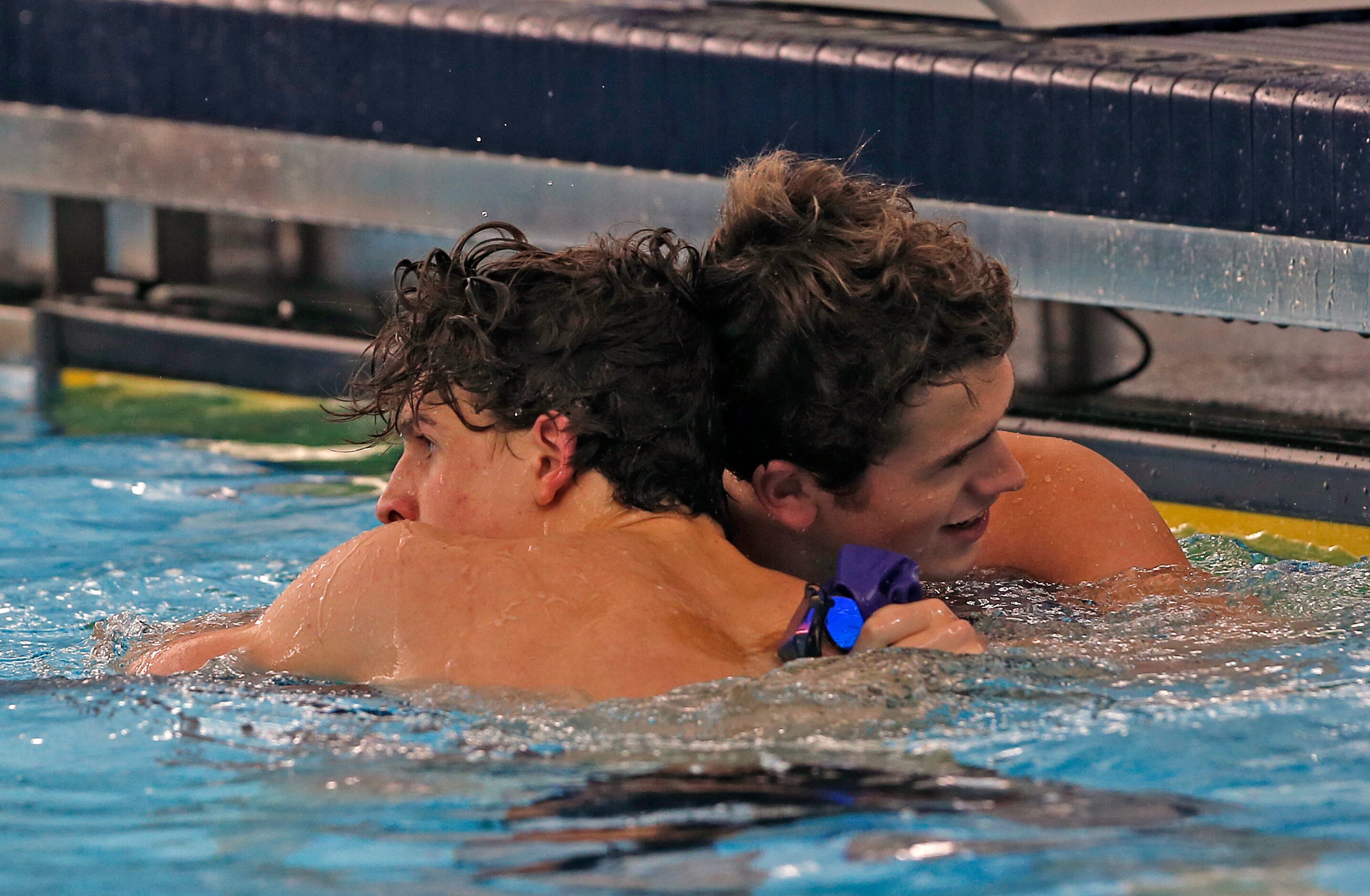 Frisco's Jon VanZandt congratulates winner Jake Litchfield,LFUL. UIL boys 5A swim finals on...