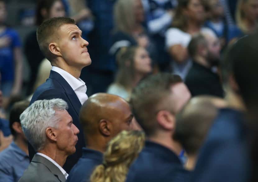 Kristaps Porzingis looks to the scoreboard prior to the start of a game between the...