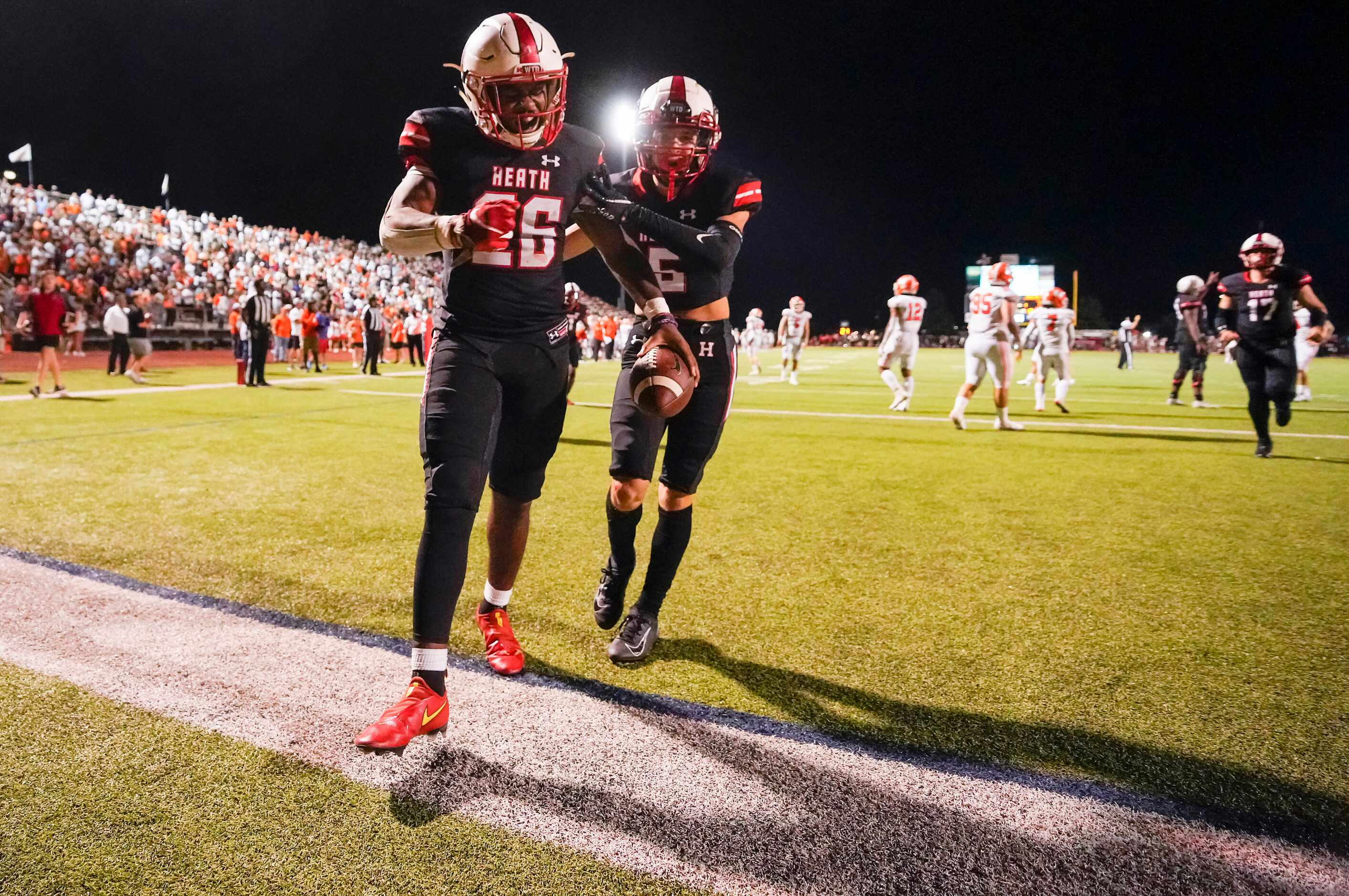 Rockwall-Heath running back  Zach Evans (26) celebrates after scoring on a 3-yard touchdown...