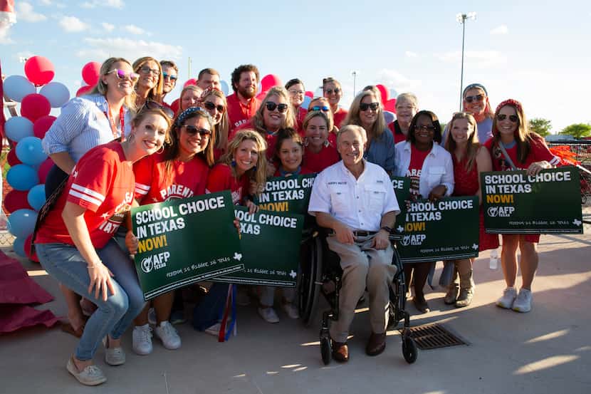 Governor Greg Abbott (center) hosts a tailgate at the First Dallas Academy football game at...