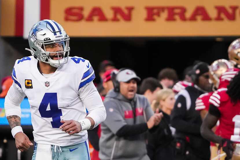 Dallas Cowboys quarterback Dak Prescott (4) leaves the field after having a pass intercepted...