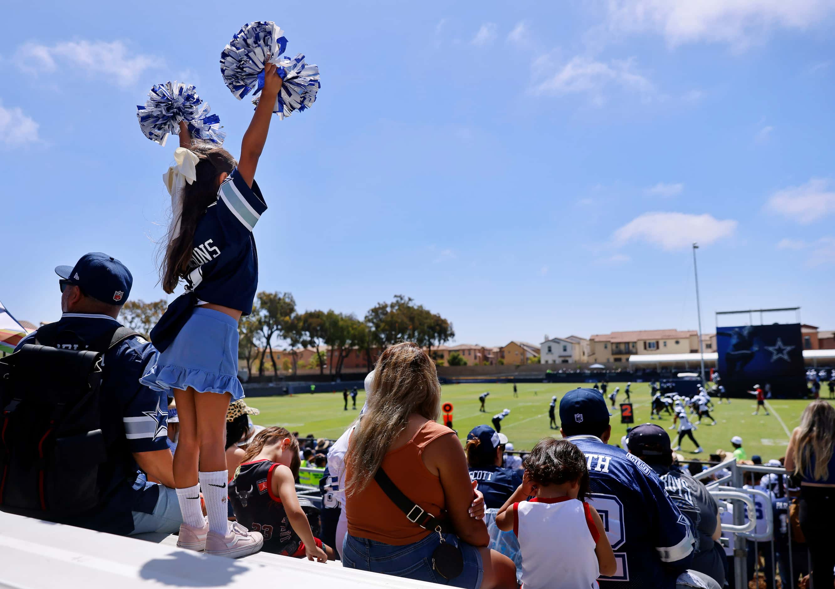 Dallas Cowboys fan Malia Herrera, 7, of Orange County, California cheers her team from the...