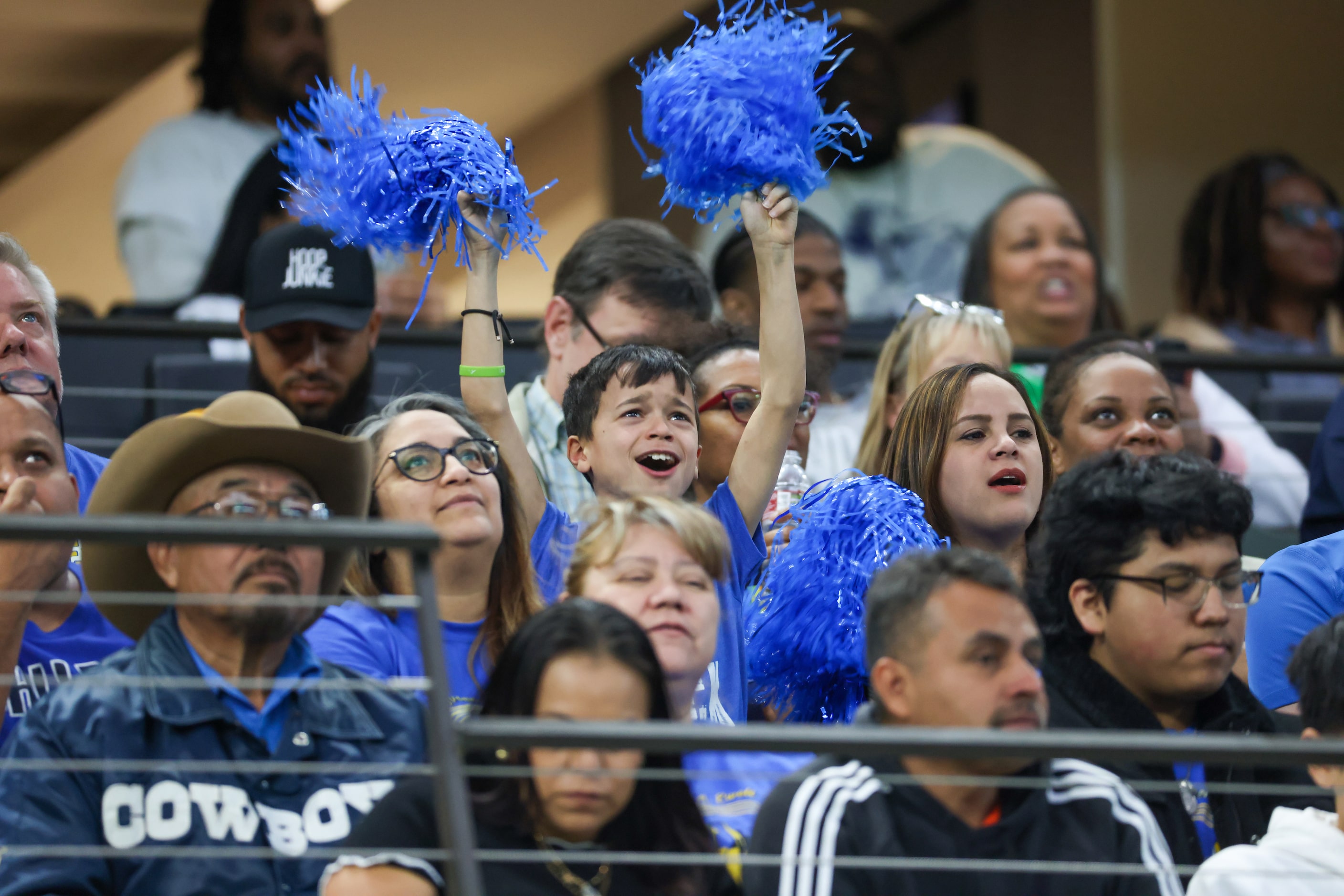 A young attendee yells along to the lyrics of Justin Bieber’s “Baby,” during a break between...