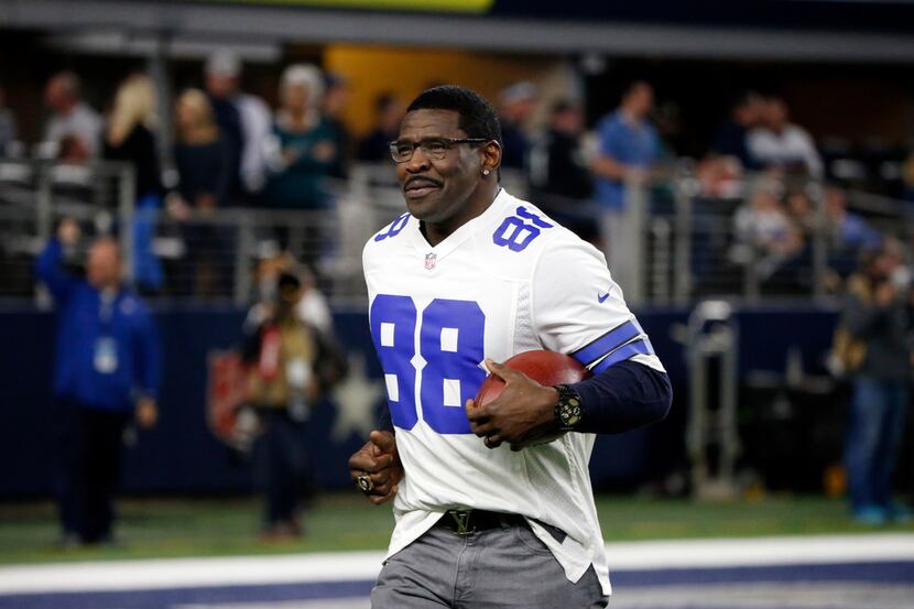 Former Dallas Cowboys receiver Michael Irvin leaves the field after he was introduced along...