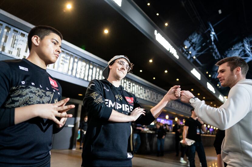 FILE - James "Clayster" Eubanks, center, greets a fan as he and teammate Anthony "Shotzzy"...