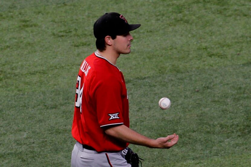 Texas Tech pitcher Micah Dallas (34) tosses the ball up in the air between pitches to an Ole...