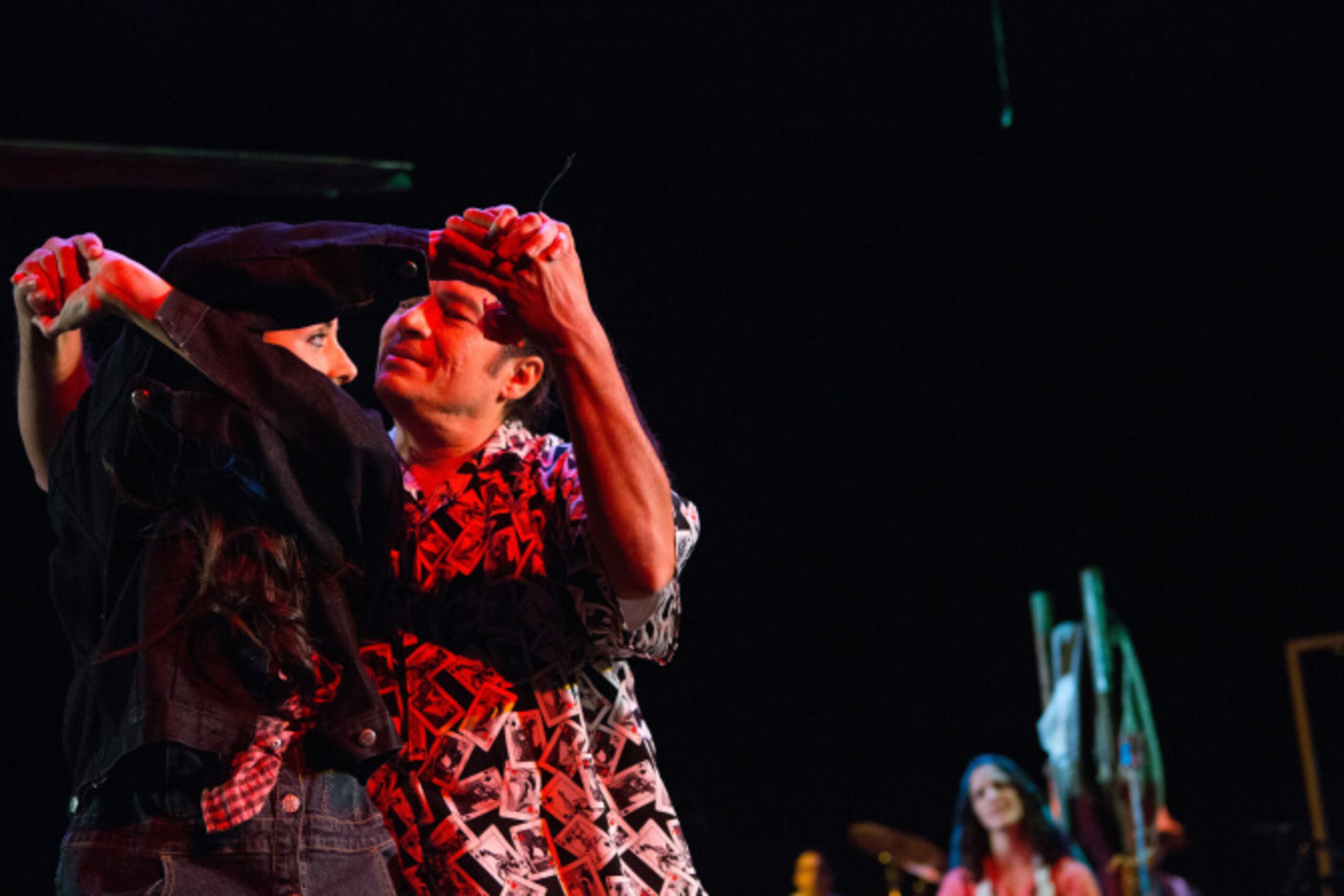 Ana Gonzalez and Rodney Garza, right, of the Cara Mia Theatre Company dance during a...