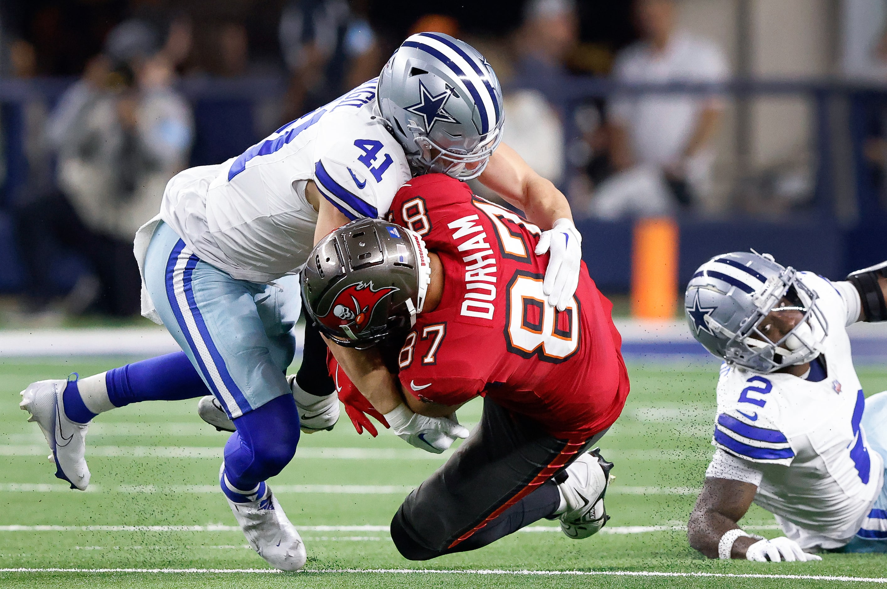 Dallas Cowboys linebacker Nick Vigil (41) tackles Tampa Bay Buccaneers tight end Payne...