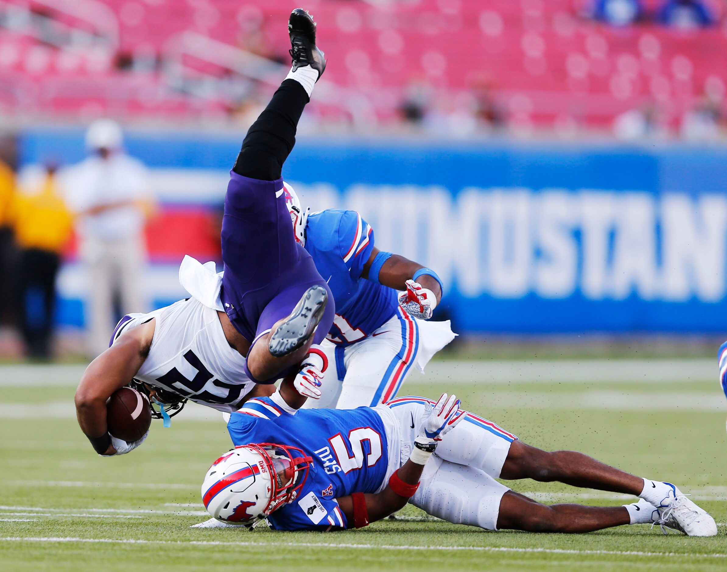 Southern Methodist Mustangs cornerback Ar'mani Johnson (5) tackles Stephen F. Austin...