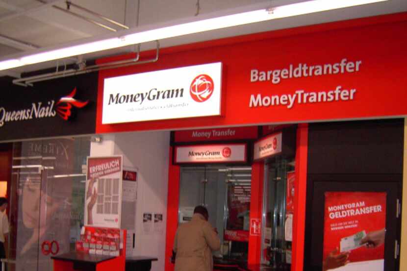  A man conducts business at a MoneyGram site in Essen, Germany