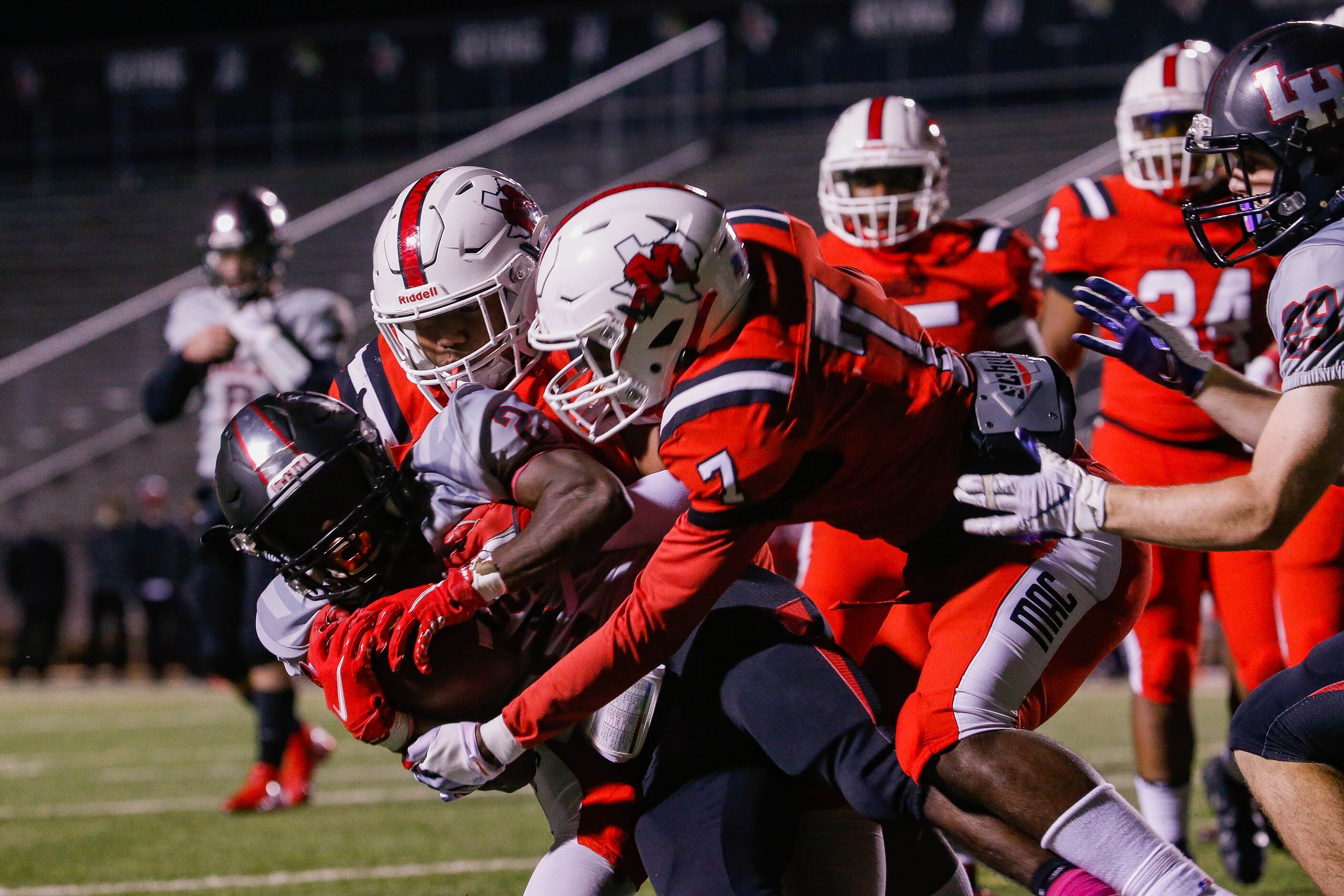 Lake Highlands Noelle Whitehead (2) is brought down by the Irving MacArthur defense during a...